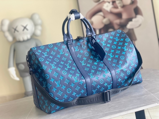 Сумки Keepall BANDOULIÈRE 50 голубые Бостон сумки больших заклеймленных людей
