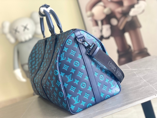 Сумки Keepall BANDOULIÈRE 50 голубые Бостон сумки больших заклеймленных людей