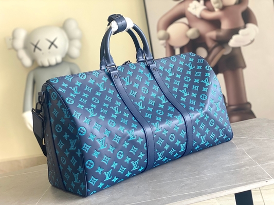 Сумки Keepall BANDOULIÈRE 50 голубые Бостон сумки больших заклеймленных людей